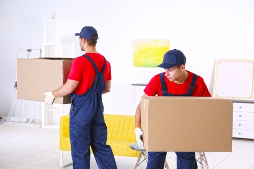 Removal van and moving boxes in Stratford residential street