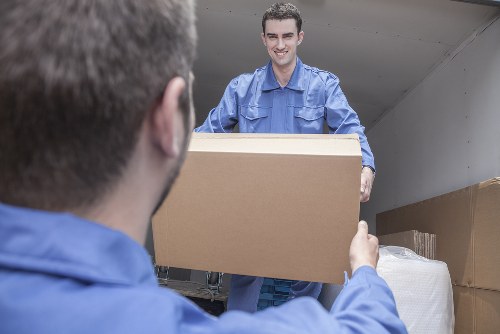 Removal team planning a move in Stratford with boxes and furniture