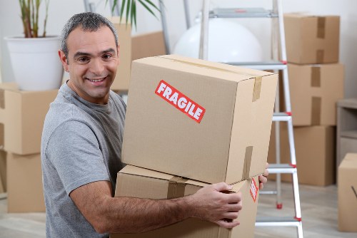 Removal van and moving boxes representing Stratford house removals