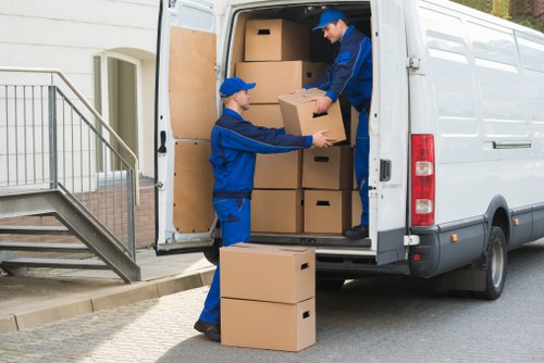 Senior staff reviewing a customer issue in a removals office