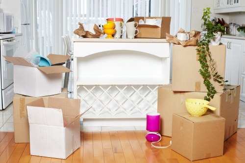 Furniture and boxes being loaded into a removal van