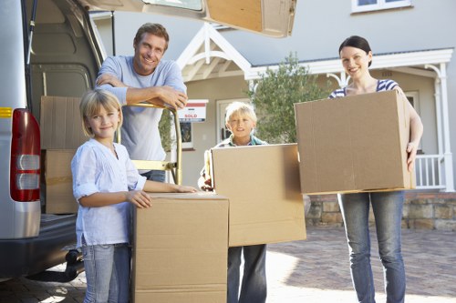 Packed moving boxes and furniture ready for local removals in Stratford