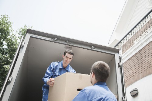 Loading boxes and furniture into a van in Stratford